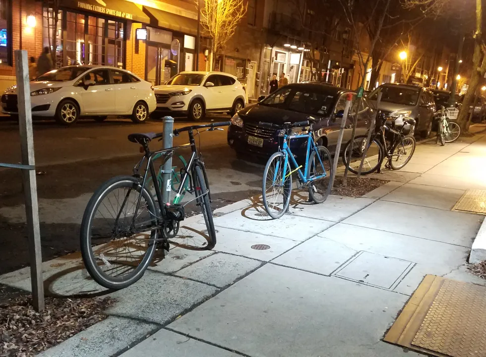 Photograph of bicycles and street trees